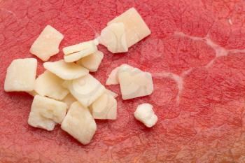 Italian aged cheese on the background of smoked meat