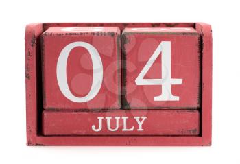 Fourth of July. Red, wooden, square calendar. Isolate on white.