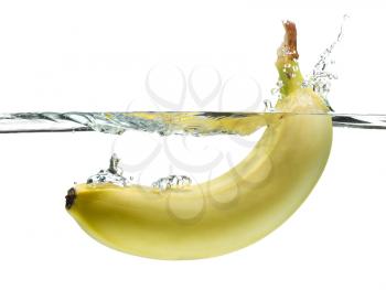 Banana splashing in clear water isolated on white.