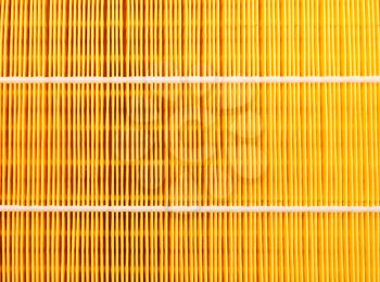 Background of a yellow car air filter closeup.