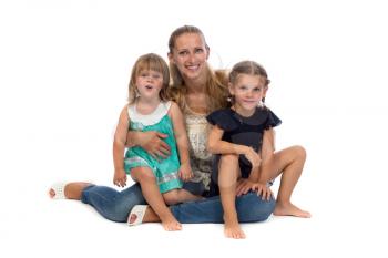 Family portrait of a young mother and two daughters, isolate on white background.