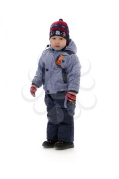 three-year boy in winter clothes in studio. Isolate on white.