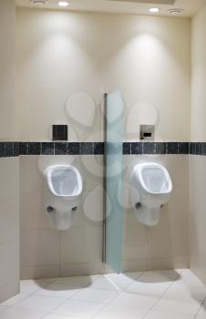 Urinal in men's room of a luxury hotel