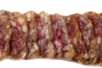 Fouette sausage sliced close up, isolate on a white background
