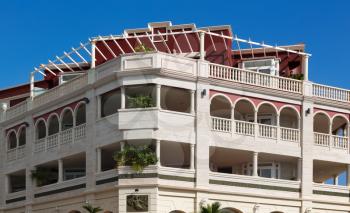 The hotel's facade against the blue sky.