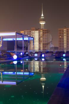 Resort building with the swimming pool at night time