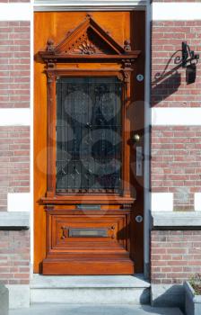 Elegant antique wooden door. Gouda, Netherlands.