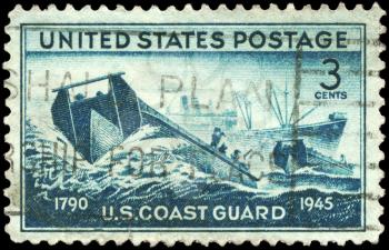 Royalty Free Photo of a 1945 US Stamp of the Coast Guard Landing Craft and Supply Ship, Achievements of the US Coast Guard in WWII