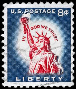 Royalty FreePhoto of 1958 US Stamp Shows the Statue of Liberty, With the Inscription In God We Trust