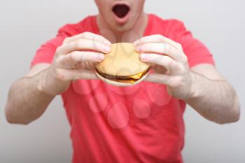 Royalty Free Photo of a Man Eating a Hamburger