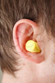 Royalty Free Photo of a Man Wearing Earplugs