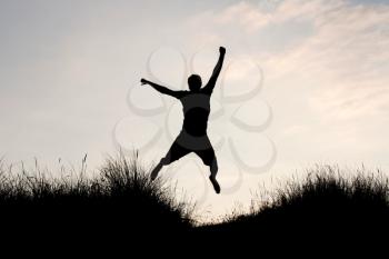 Royalty Free Photo of a Man Jumping Up