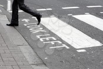Royalty Free Photo of a Person Crossing the Street