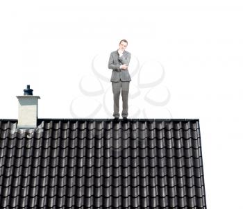 A businessman on top of a roof