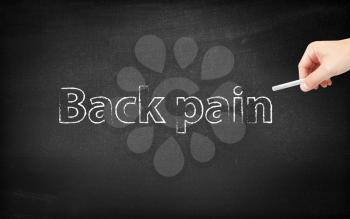 Back pain written on a blackboard