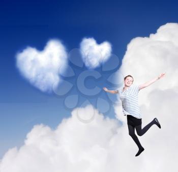 Heartshaped cloud with girl in love