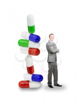 Pills in a stack with businessman