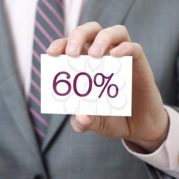 60% written on a card held by a businessman