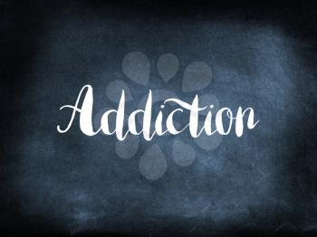 Addiction written on a blackboard