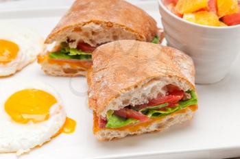 Royalty Free Photo of a Ciabatta Sandwich with Fruit and Eggs