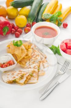 original Mexican quesadilla de pollo with nachos  served with gazpacho soup and watermelon ,with fresh vegetables on background,MORE DELICIOUS FOOD ON PORTFOLIO