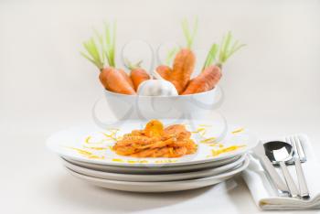 fresh  and healthy Honey glazed carrots on a plate with tyme on top