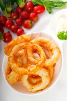 golden deep fried onion rings served with mayonnaise dip  and fresh vegetables oln background ,MORE DELICIOUS FOOD ON PORTFOLIO