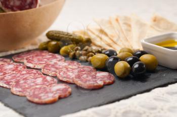 fresh cold cut platter with pita bread and pickles antipasti