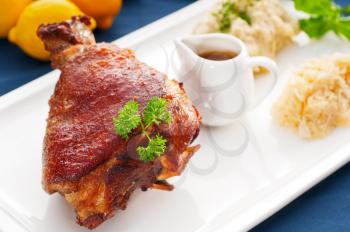 original German BBQ pork  knuckle served with mashed potatoes and  sauerkraut ,fresh vegetables on background,MORE DELICIOUS FOOD ON PORTFOLIO