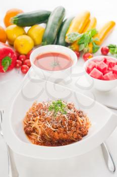 Italian classic  spaghetti with bolognese sauce and fresh vegetables on background,MORE DELICIOUS  FOOD ON PORTFOLIO