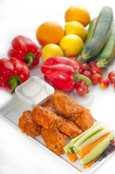 classic  buffalo chicken wings served with fresh pinzimonio and vegetables on background,MORE DELICIOUS FOOD ON PORTFOLIO