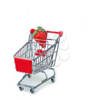 strawberry on shopping cart over white