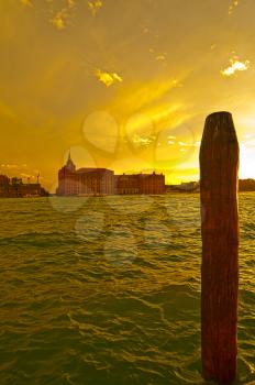 Venice Italy lagune view with bricole timber planted to sign the way of the canal