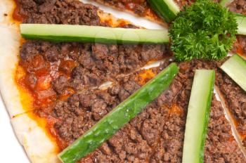 fresh baked Turkish beef pizza with cucumber on top