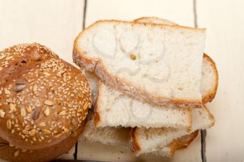 fresh organic bread over rustic table macro closeup