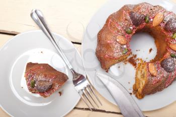 fresh chestnut cake bread dessert with almonds and pistachios on top