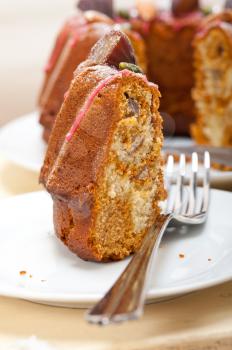 fresh chestnut cake bread dessert with almonds and pistachios on top