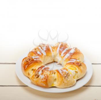 fresh home baked sweet bread donut cake with almonds and icing sugar on top