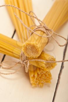 bunch of Italian pasta type on a white rustic table 