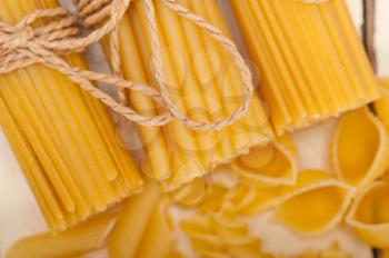 bunch of Italian pasta type on a white rustic table 