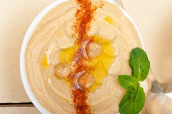 traditional chickpeas Hummus with mint olive oil and paprika on top 