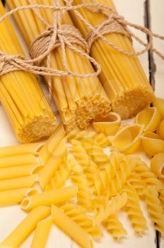 bunch of Italian pasta type on a white rustic table 