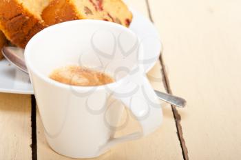 plum cake and espresso coffee over a white rustic table 