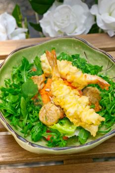 fresh deep fried Japanese tempura shrimps with salad and sea urchin 