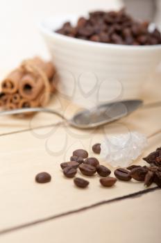 espresso coffee  over white wood rustic table  with sugar and spice