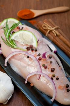 fresh organic chicken breast with herbs and spices