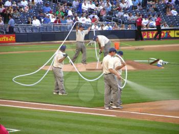 Royalty Free Photo of People Preparing The Infield