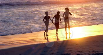 Royalty Free Photo of Friends Waking on the Beach