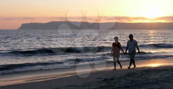 Royalty Free Photo of a Couple Walking on the Beach