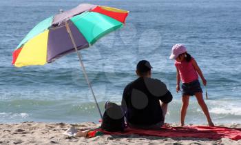 Royalty Free Photo of a Father and Daughter on the Beach